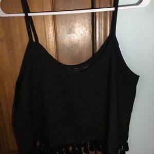 Cropped black tank top with fringe at the bottom